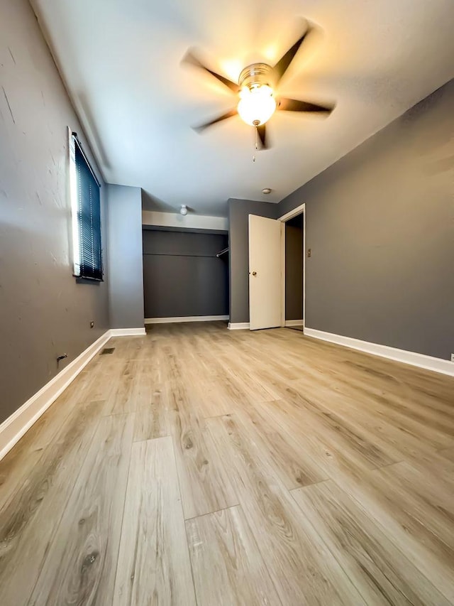 interior space with ceiling fan and light wood-type flooring