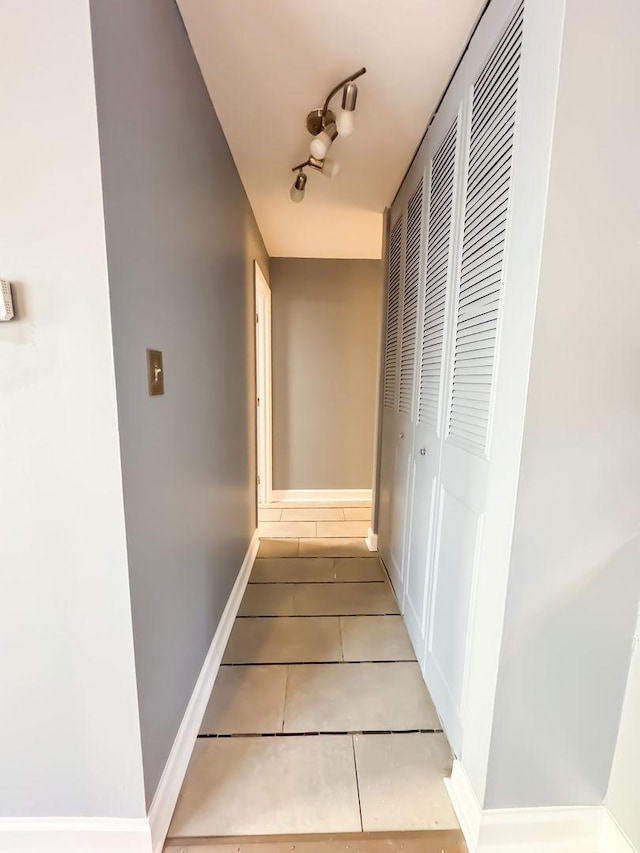 hall with light tile patterned flooring