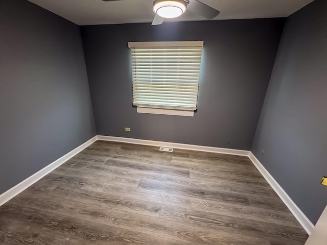 empty room featuring ceiling fan and hardwood / wood-style flooring