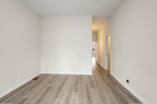 unfurnished room featuring light hardwood / wood-style floors