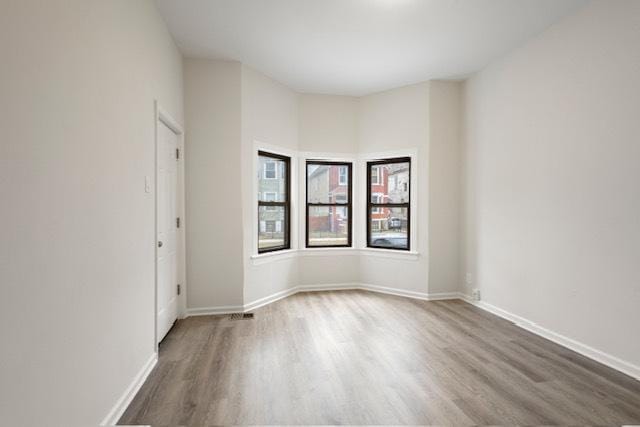 empty room featuring hardwood / wood-style floors