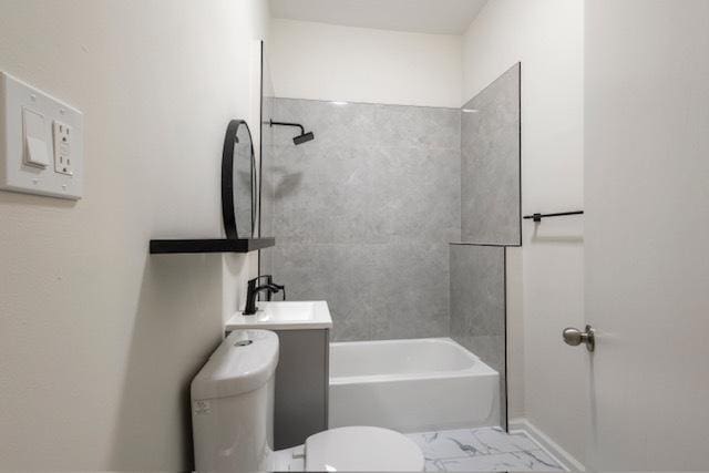 full bathroom with vanity, toilet, and tiled shower / bath