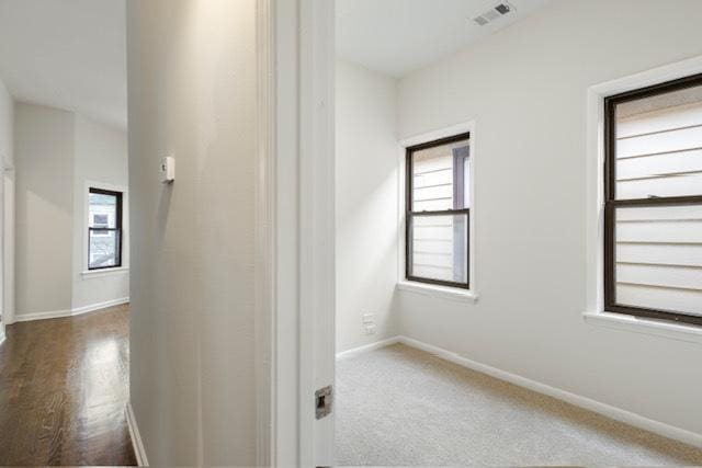 corridor featuring carpet floors