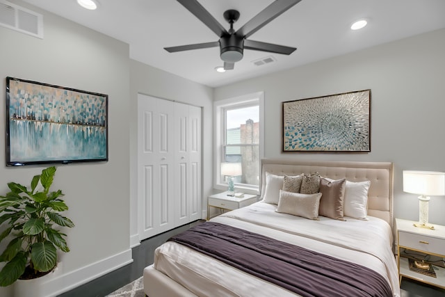 bedroom featuring a closet, ceiling fan, and dark hardwood / wood-style floors