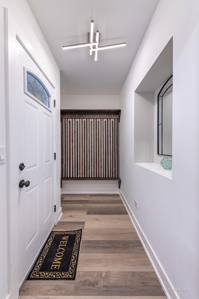 hallway with wood-type flooring