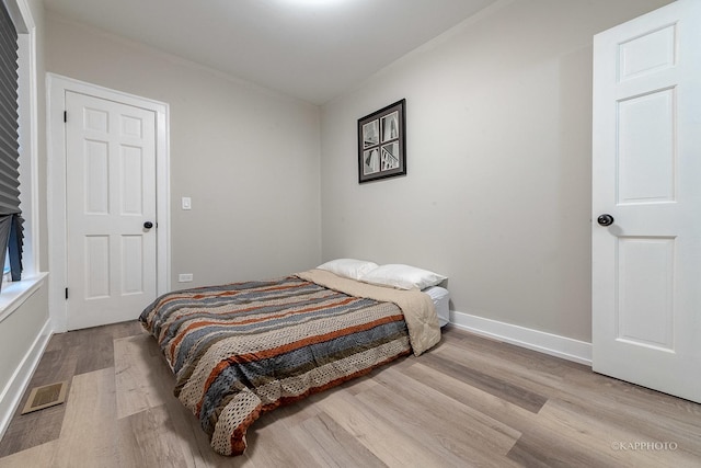 bedroom with light hardwood / wood-style floors