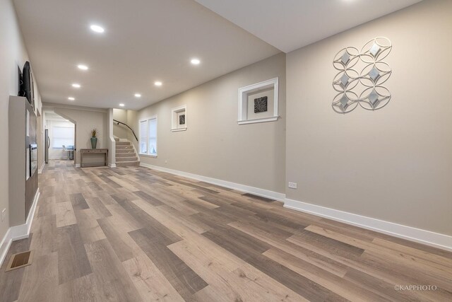 basement featuring light hardwood / wood-style flooring