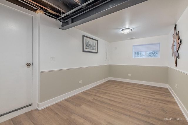 basement featuring light wood-type flooring