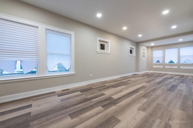 unfurnished room featuring hardwood / wood-style floors