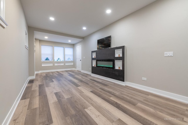 unfurnished living room with light hardwood / wood-style floors