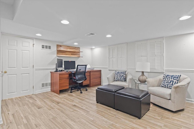 office with light wood-type flooring