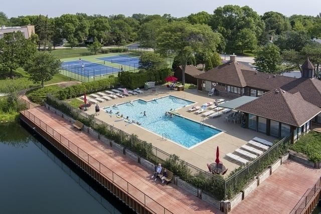 view of swimming pool with a water view