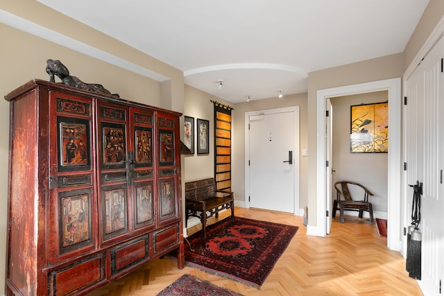 foyer with light parquet floors