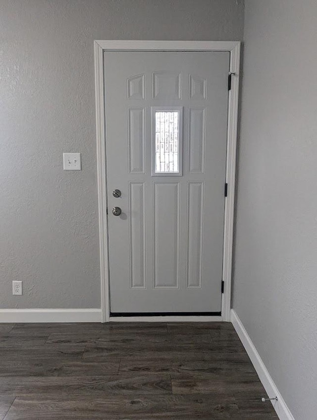 doorway featuring dark hardwood / wood-style floors