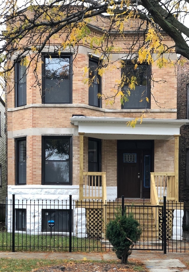 view of building exterior featuring a fenced front yard