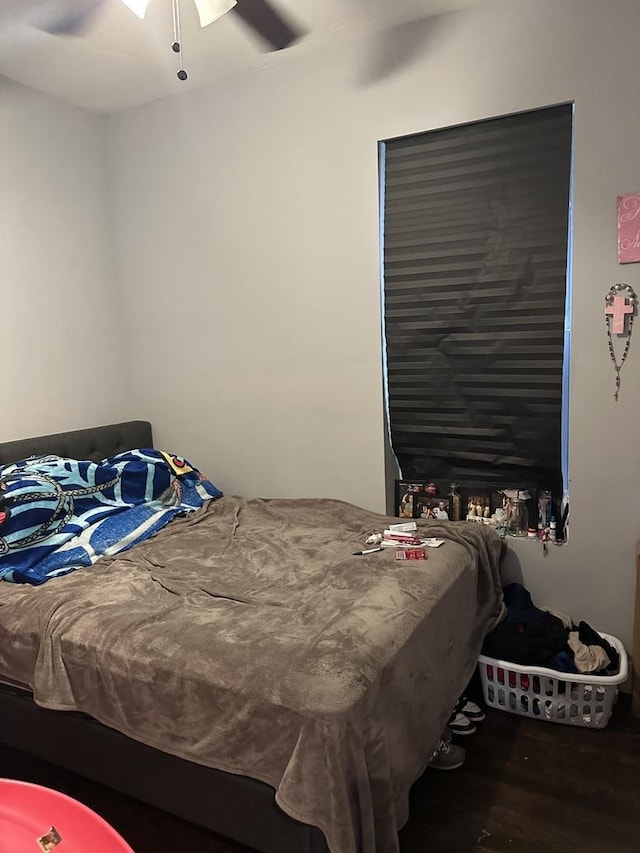 bedroom with wood finished floors and ceiling fan