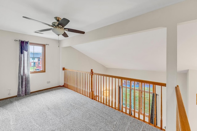 bonus room featuring carpet, vaulted ceiling with beams, and ceiling fan