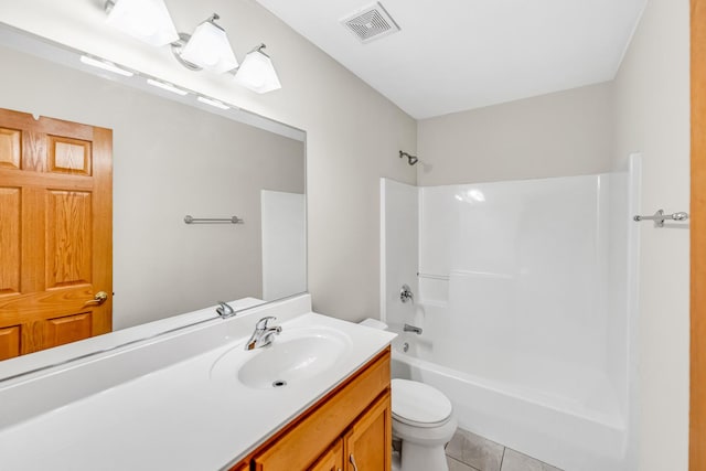 full bathroom with toilet, vanity, tile patterned floors, and tub / shower combination