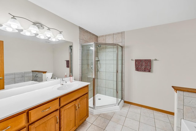 bathroom with tile patterned floors, vanity, and shower with separate bathtub