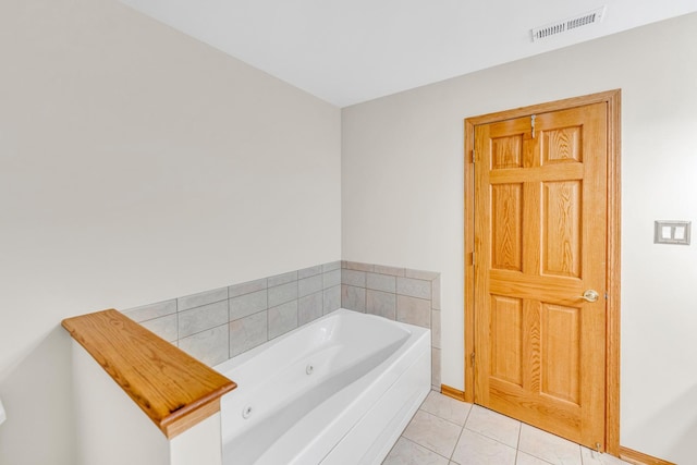 bathroom featuring tile patterned flooring and a bathtub