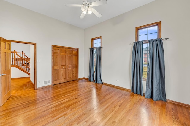 unfurnished bedroom featuring light hardwood / wood-style floors and ceiling fan