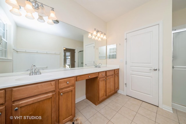 bathroom with tile patterned floors, vanity, and an enclosed shower