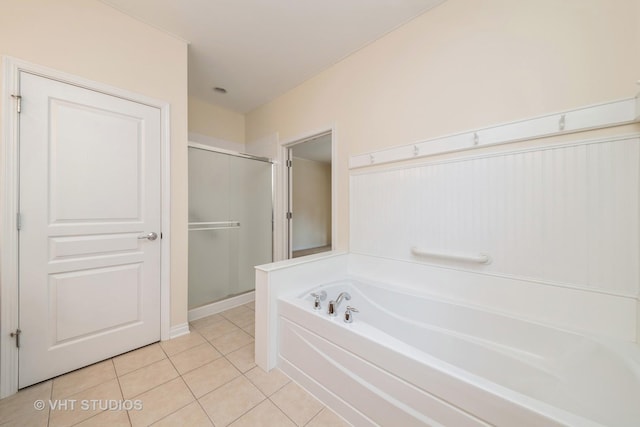 bathroom with tile patterned floors and separate shower and tub