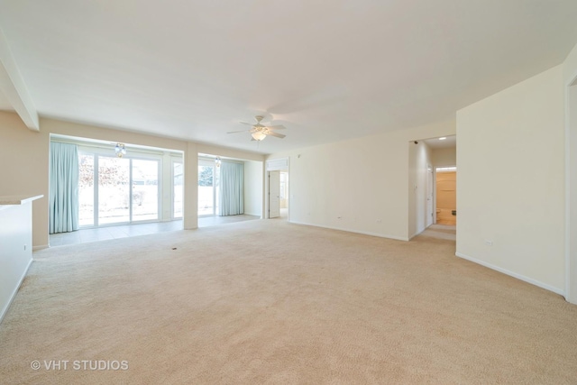 carpeted empty room with ceiling fan