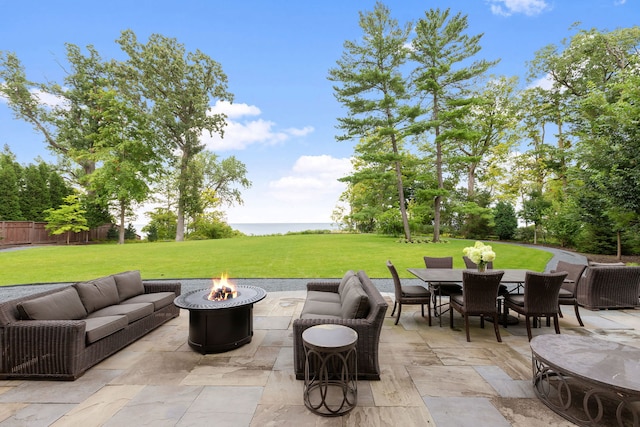 view of patio featuring an outdoor living space with a fire pit