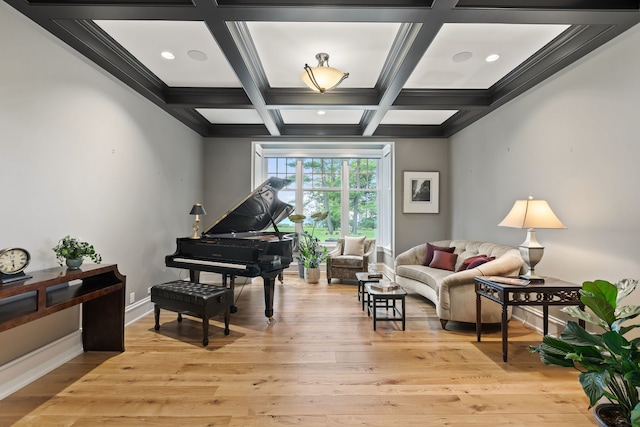 sitting room with beam ceiling, crown molding, coffered ceiling, and light hardwood / wood-style floors