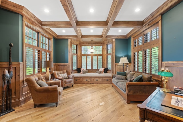 sitting room with a wealth of natural light, light wood-type flooring, beamed ceiling, and coffered ceiling