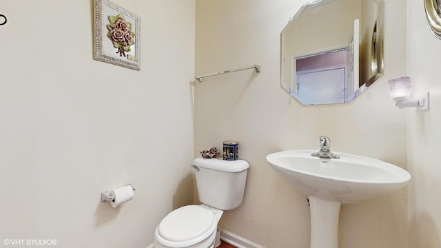 bathroom with toilet and sink