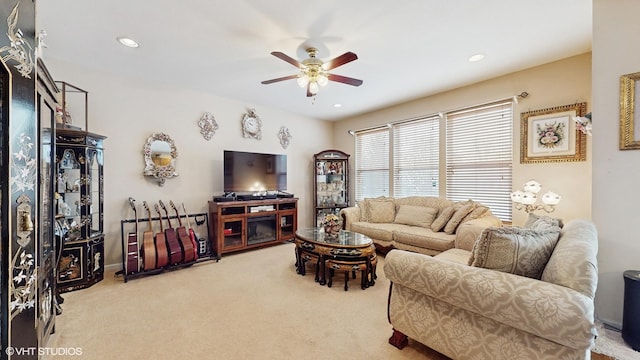 living room featuring ceiling fan and light colored carpet