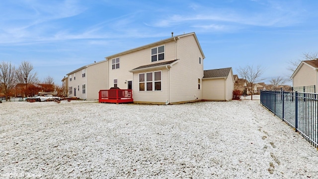 back of house featuring a deck