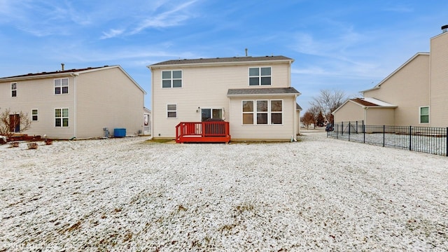 rear view of property featuring cooling unit and a deck