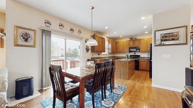 dining room with light hardwood / wood-style floors