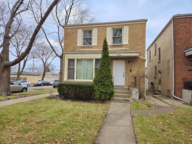 view of front of home with a front lawn