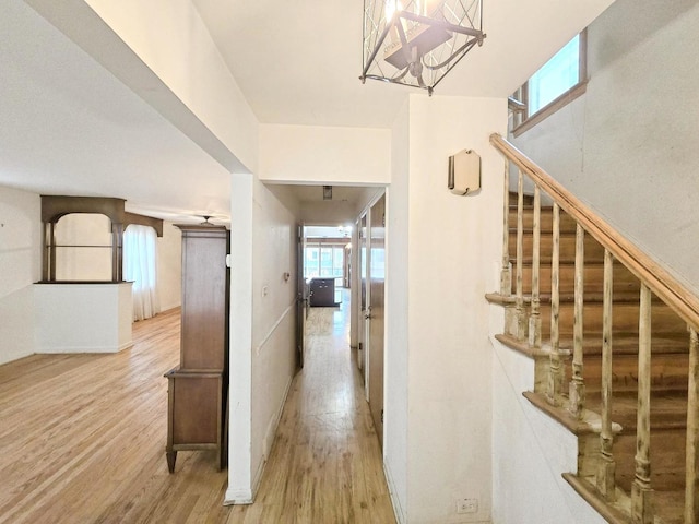 corridor with hardwood / wood-style floors