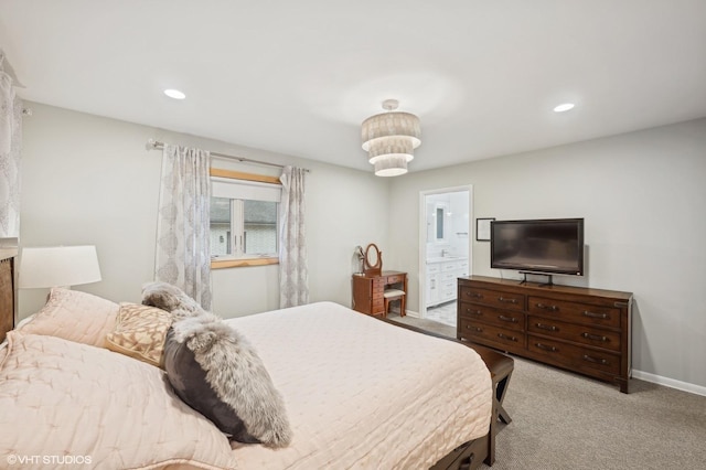 carpeted bedroom with ensuite bathroom