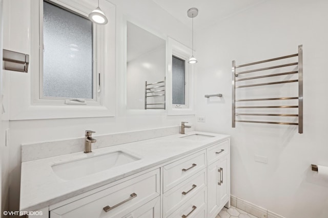 bathroom with radiator and vanity