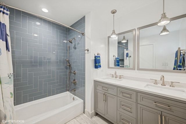 bathroom with shower / tub combo and vanity