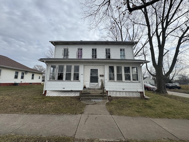 view of front of property with a front lawn