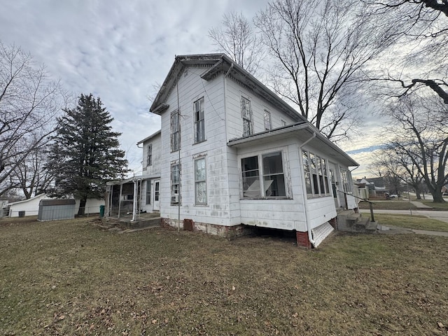 view of home's exterior with a lawn