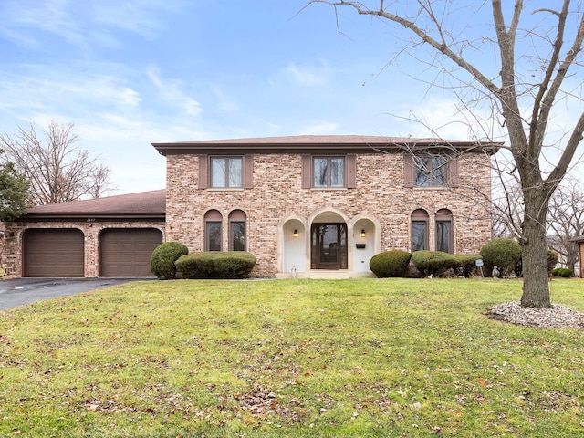 view of front facade with a front lawn and a garage