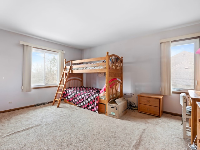 bedroom with light carpet