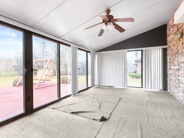 interior space featuring ceiling fan and lofted ceiling