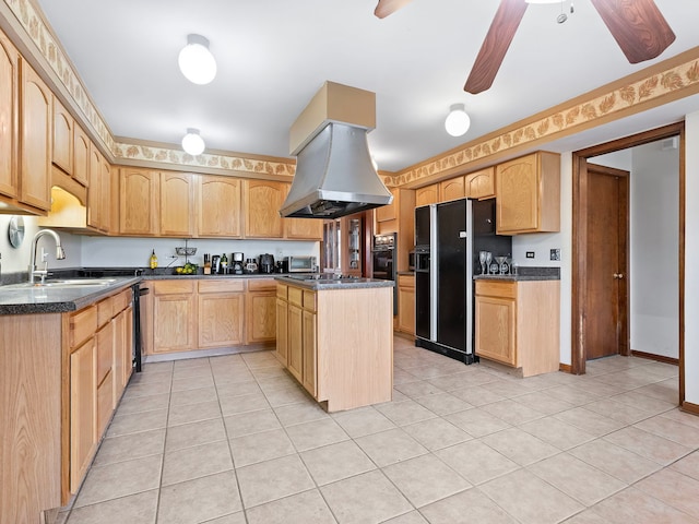 kitchen featuring light brown cabinetry, ceiling fan, sink, black appliances, and a center island