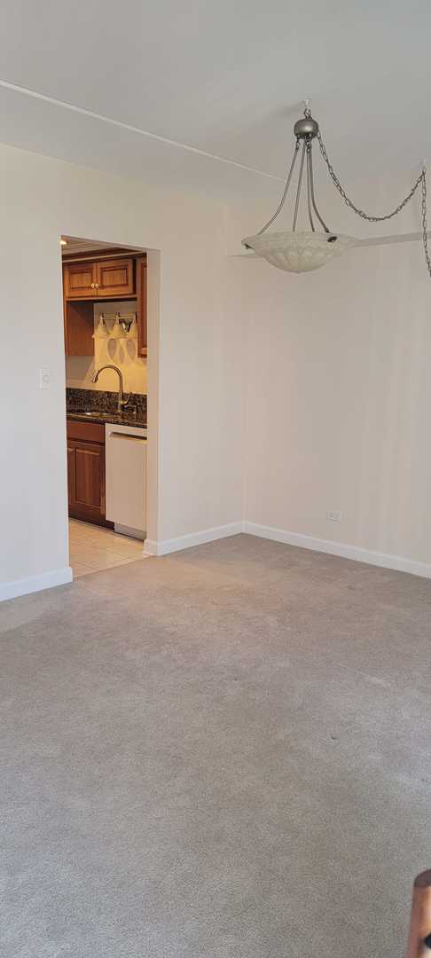 carpeted spare room with sink