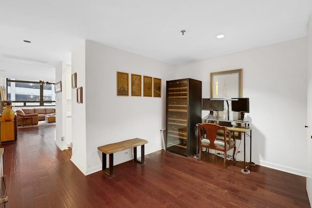 office with dark hardwood / wood-style floors and wine cooler