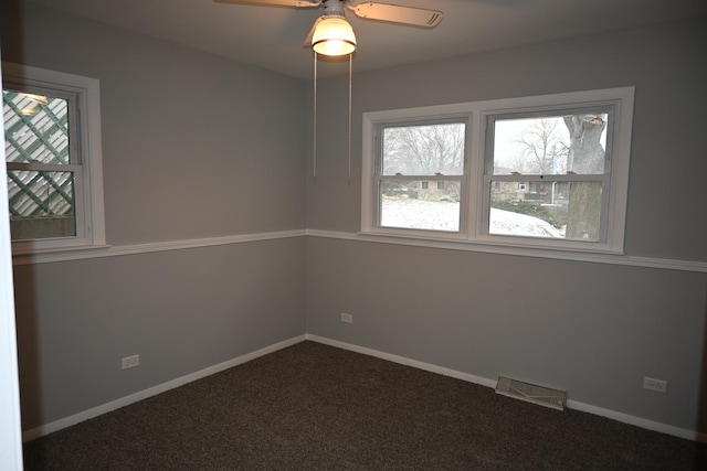 empty room featuring ceiling fan and carpet flooring